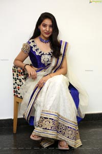 Anchor Vijayalakshmi in White Net Ornate Lehenga Choli