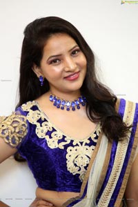 Anchor Vijayalakshmi in White Net Ornate Lehenga Choli