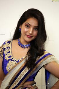 Anchor Vijayalakshmi in White Net Ornate Lehenga Choli