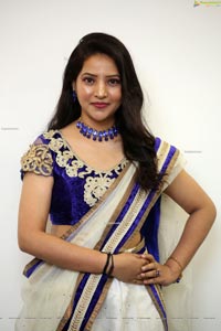 Anchor Vijayalakshmi in White Net Ornate Lehenga Choli