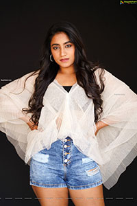 Yuktha in White Top And Denim Shorts