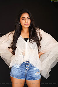 Yuktha in White Top And Denim Shorts