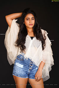 Yuktha in White Top And Denim Shorts