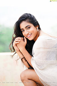 Yuktha in White Top And Denim Shorts