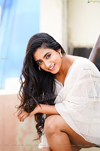 Yuktha in White Top And Denim Shorts