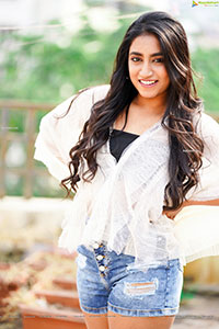 Yuktha in White Top And Denim Shorts