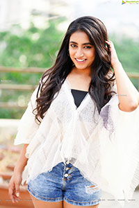 Yuktha in White Top And Denim Shorts