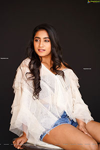 Yuktha in White Top And Denim Shorts