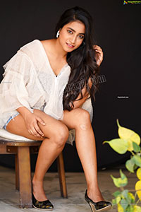 Yuktha in White Top And Denim Shorts