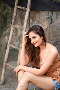 Dhriti Patel in Light Brown Peplum Top and Denim Shorts