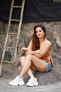 Dhriti Patel in Light Brown Peplum Top and Denim Shorts