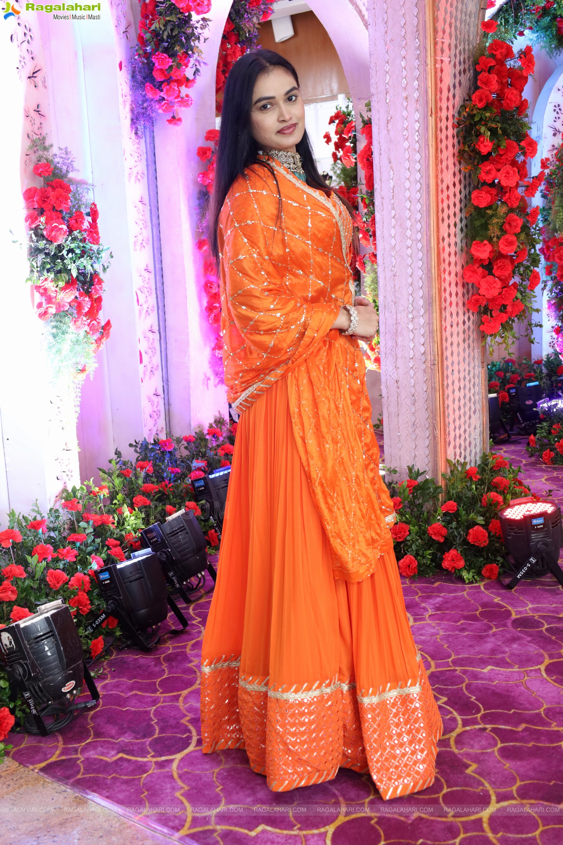 Manu Malleshwari stills in Orange Colour Designer Dress, HD Gallery