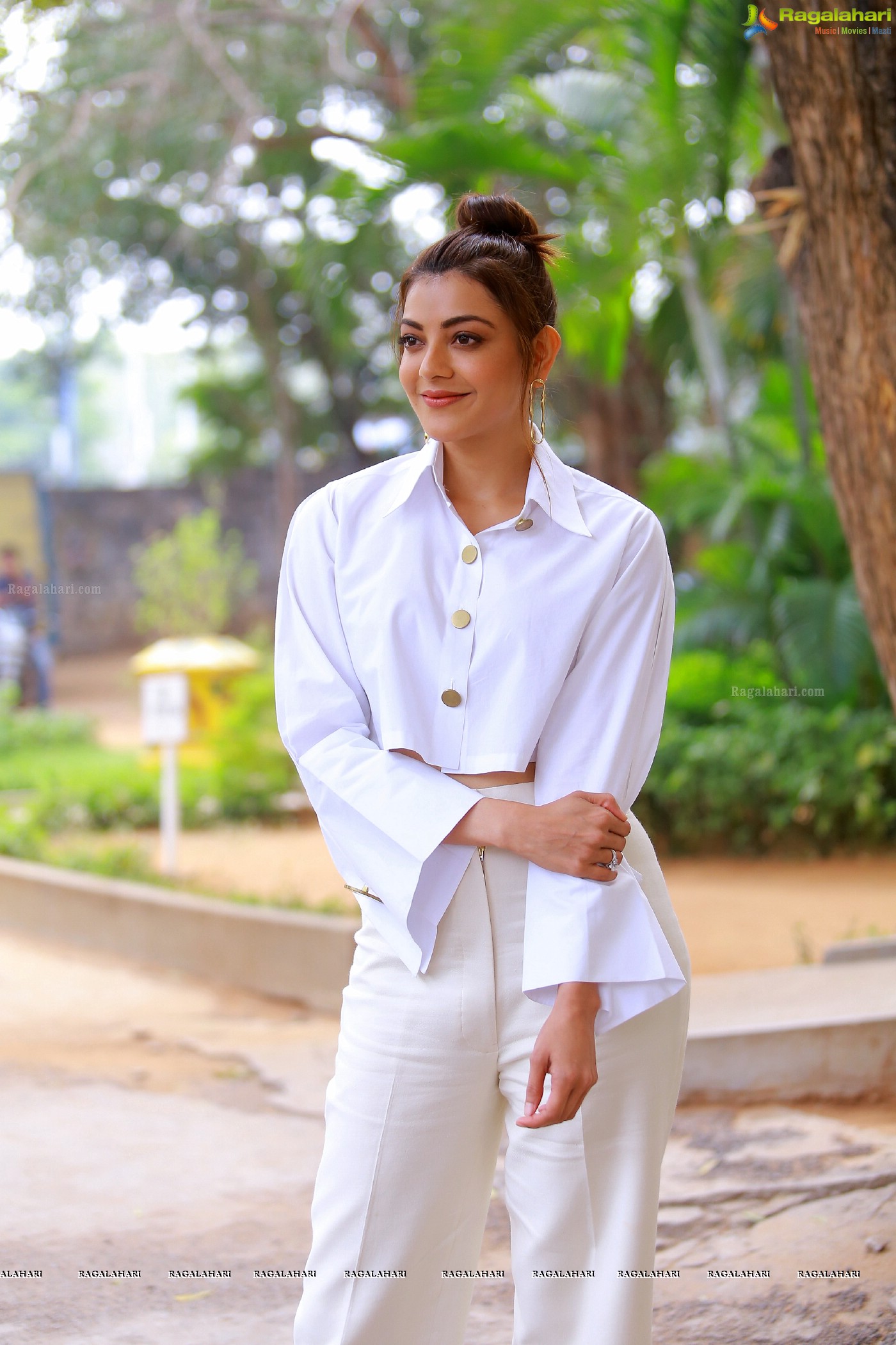 Kajal Aggarwal in White button-Up Crop Top at Kavacham Interview - Photo Gallery