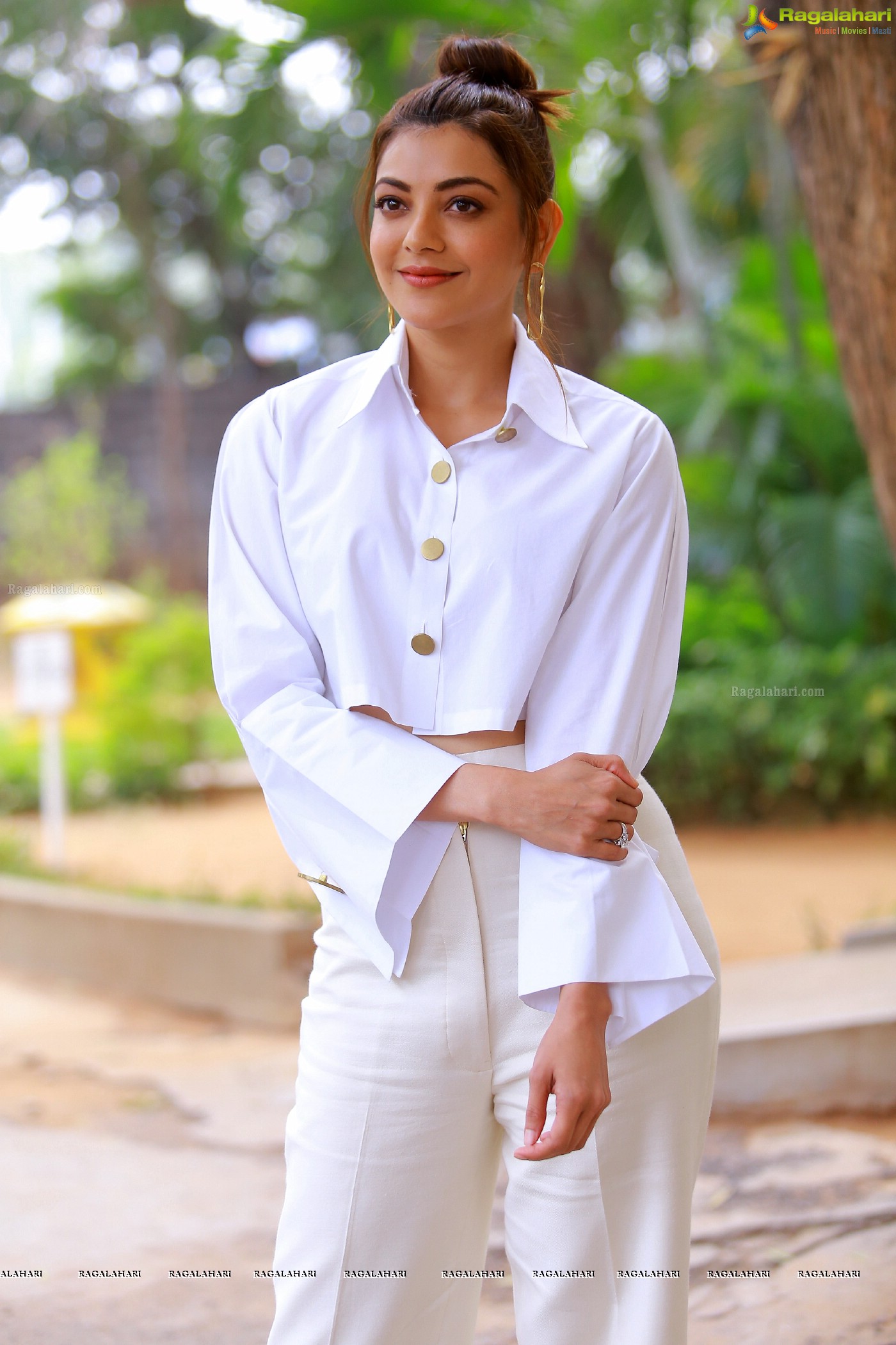 Kajal Aggarwal in White button-Up Crop Top at Kavacham Interview - Photo Gallery
