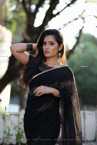 Anusha Parada in Black Saree With Gold Border