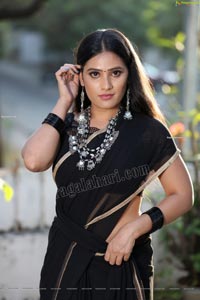 Anusha Parada in Black Saree With Gold Border