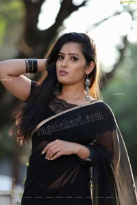 Anusha Parada in Black Saree With Gold Border