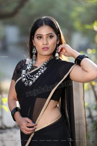 Anusha Parada in Black Saree With Gold Border