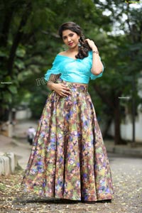 Indu in Sky Blue Frill Crop Top and Floral Lehenga