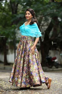 Indu in Sky Blue Frill Crop Top and Floral Lehenga