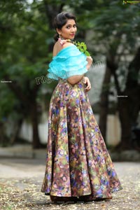 Indu in Sky Blue Frill Crop Top and Floral Lehenga