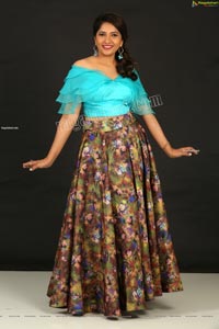 Indu in Sky Blue Frill Crop Top and Floral Lehenga