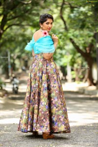 Indu in Sky Blue Frill Crop Top and Floral Lehenga