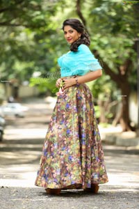 Indu in Sky Blue Frill Crop Top and Floral Lehenga