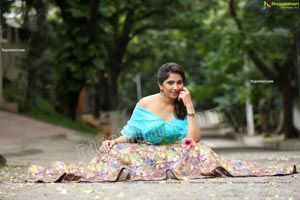 Indu in Sky Blue Frill Crop Top and Floral Lehenga