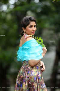 Indu in Sky Blue Frill Crop Top and Floral Lehenga