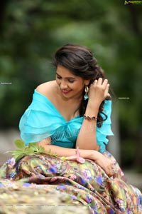 Indu in Sky Blue Frill Crop Top and Floral Lehenga