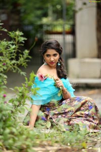 Indu in Sky Blue Frill Crop Top and Floral Lehenga