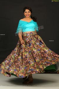 Indu in Sky Blue Frill Crop Top and Floral Lehenga