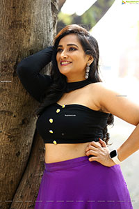 Anchor Madhu Krishnan in Purple Lehenga