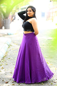 Anchor Madhu Krishnan in Purple Lehenga