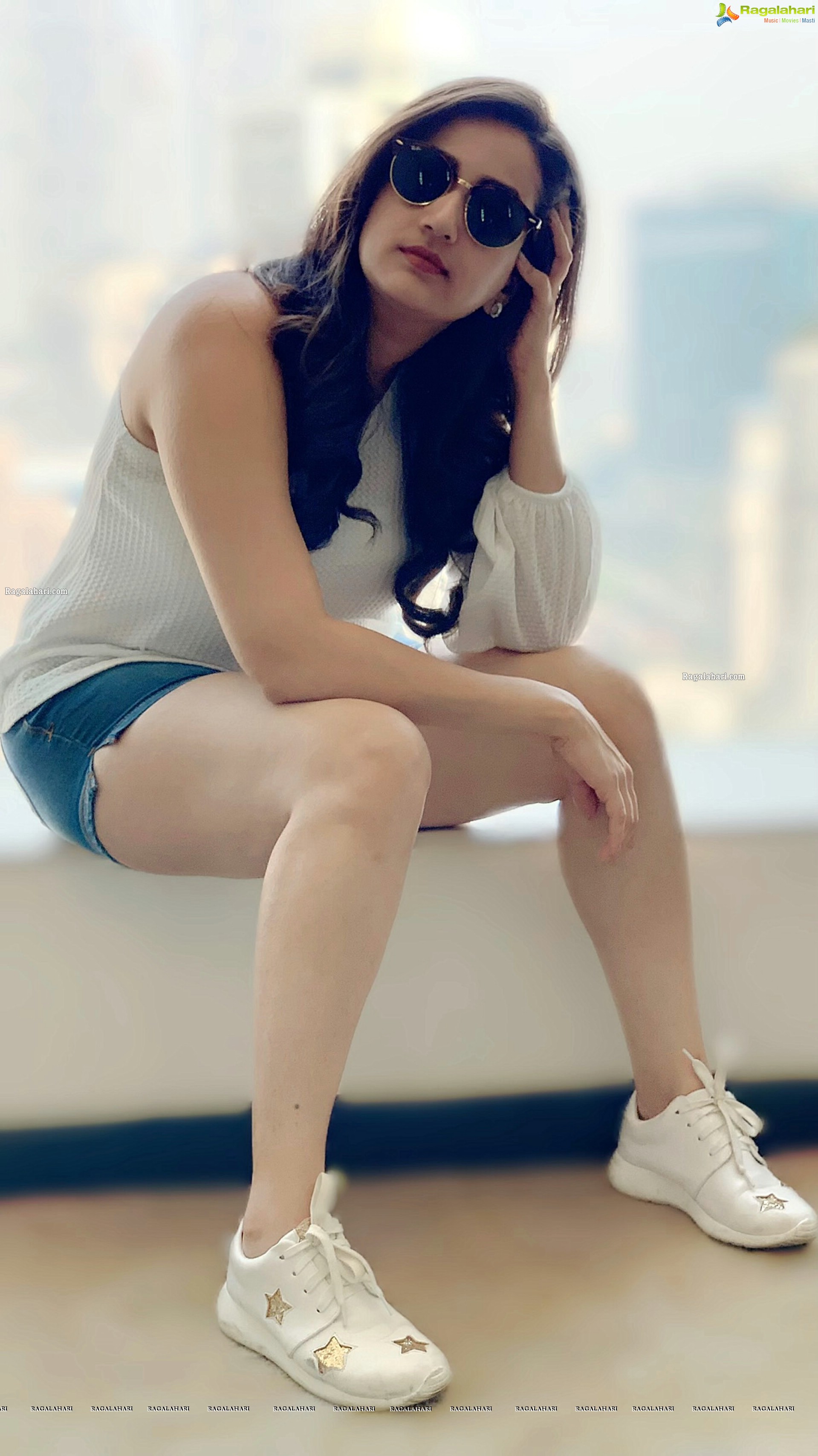 Manjusha in Denim Shorts and a White One Shoulder Top, HD Photo Gallery