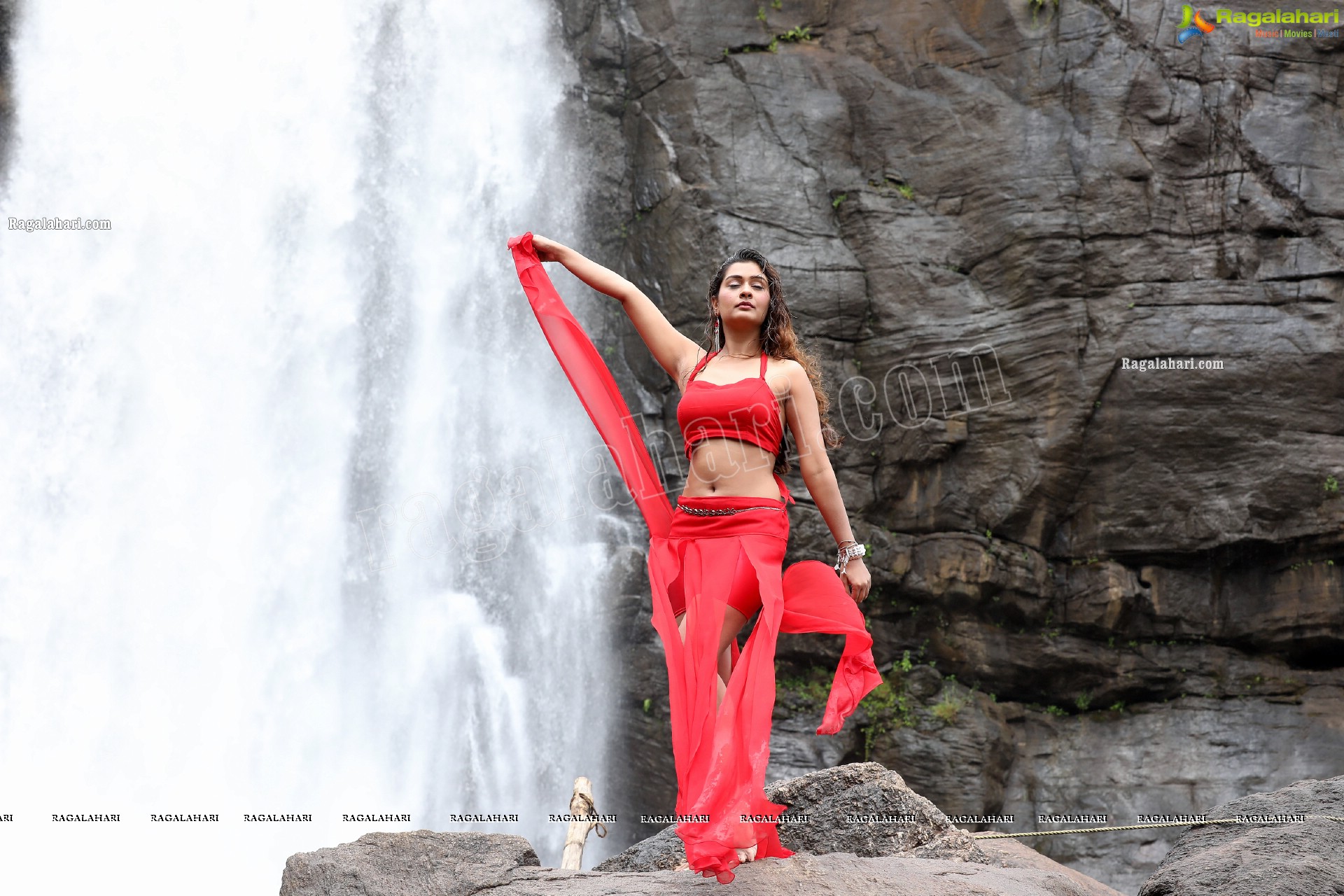 Payal Rajput Posing Provocatively in a Red Flowing Dress at a Waterfall, Exclusive