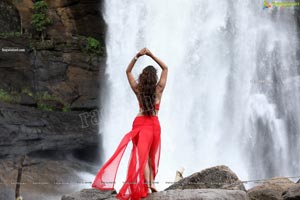 Payal Rajput Posing in a Red Flowing Dress
