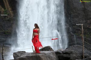 Payal Rajput Posing in a Red Flowing Dress