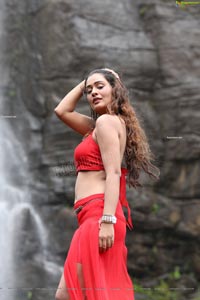 Payal Rajput Posing in a Red Flowing Dress