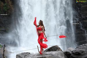 Payal Rajput Posing in a Red Flowing Dress