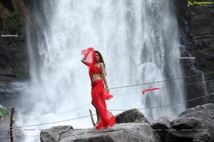 Payal Rajput Posing in a Red Flowing Dress