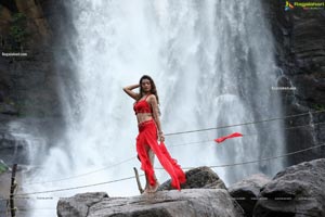 Payal Rajput Posing in a Red Flowing Dress