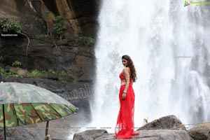 Payal Rajput Posing in a Red Flowing Dress