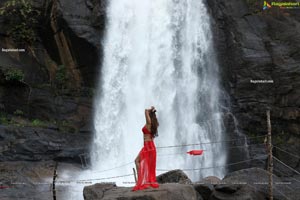 Payal Rajput Posing in a Red Flowing Dress