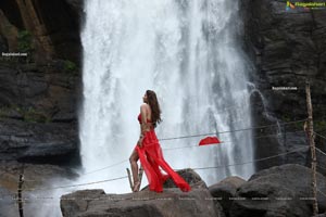 Payal Rajput Posing in a Red Flowing Dress