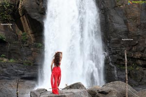 Payal Rajput Posing in a Red Flowing Dress