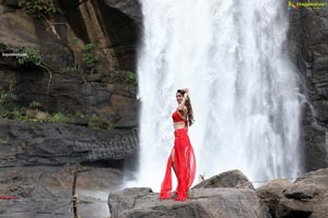 Payal Rajput Posing in a Red Flowing Dress