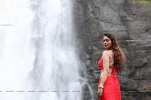 Payal Rajput Posing in a Red Flowing Dress