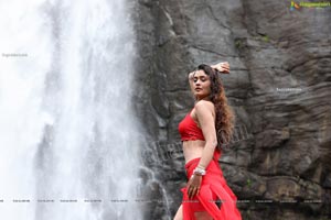 Payal Rajput Posing in a Red Flowing Dress